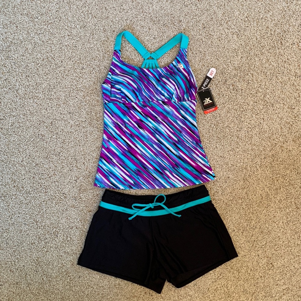 NWT - Zeroxposur Tankini/Shorts
2pc Bathing Swim Suit
Black/Purple/Aqua (Size 8)